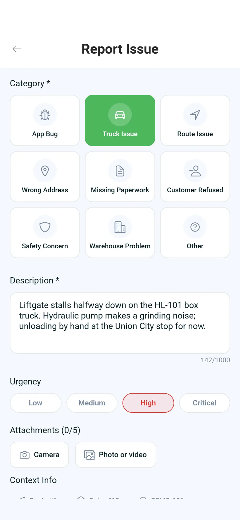 Report Issue screen in the RushHour driver app: Truck Issue selected, a description of a liftgate that stalls, High urgency and buttons to add photos or video